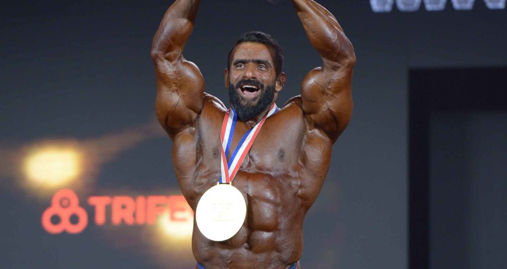 https://sorkhnews.com/wp-content/uploads/2022/12/Hadi-Choopan-2022-Mr.-Olympia-Champion-1024x543-1.jpg